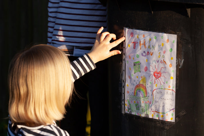 girl giving thank you note